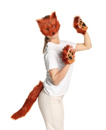 Quadrobics. Woman wearing fox mask, gloves and tail on white background