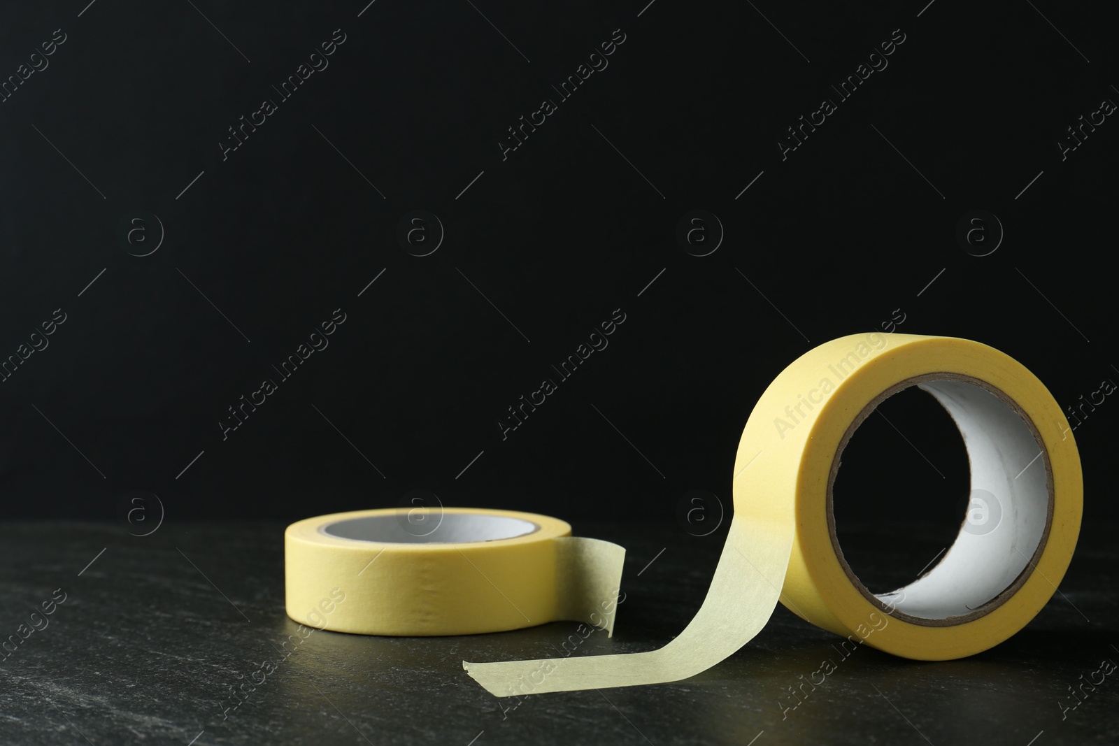 Photo of Rolls of masking tape on black table