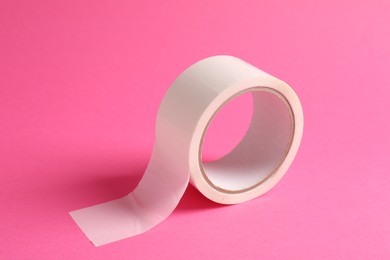 One masking tape on pink background, closeup