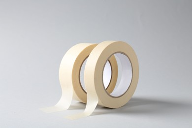 Two masking tapes on grey background, closeup