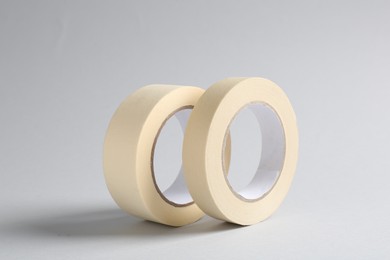 Two masking tapes on grey background, closeup