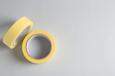 Two masking tapes on grey background, top view. Space for text