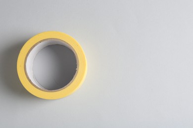 Photo of One masking tape on grey background, top view. Space for text