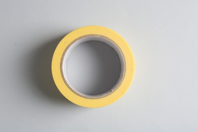 One masking tape on grey background, top view