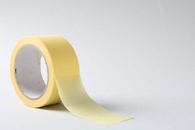 One masking tape on grey background, closeup. Space for text