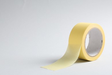 One masking tape on grey background, closeup. Space for text