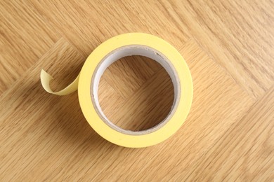 One masking tape on wooden table, top view