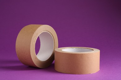 Photo of Rolls of masking tapes on violet background