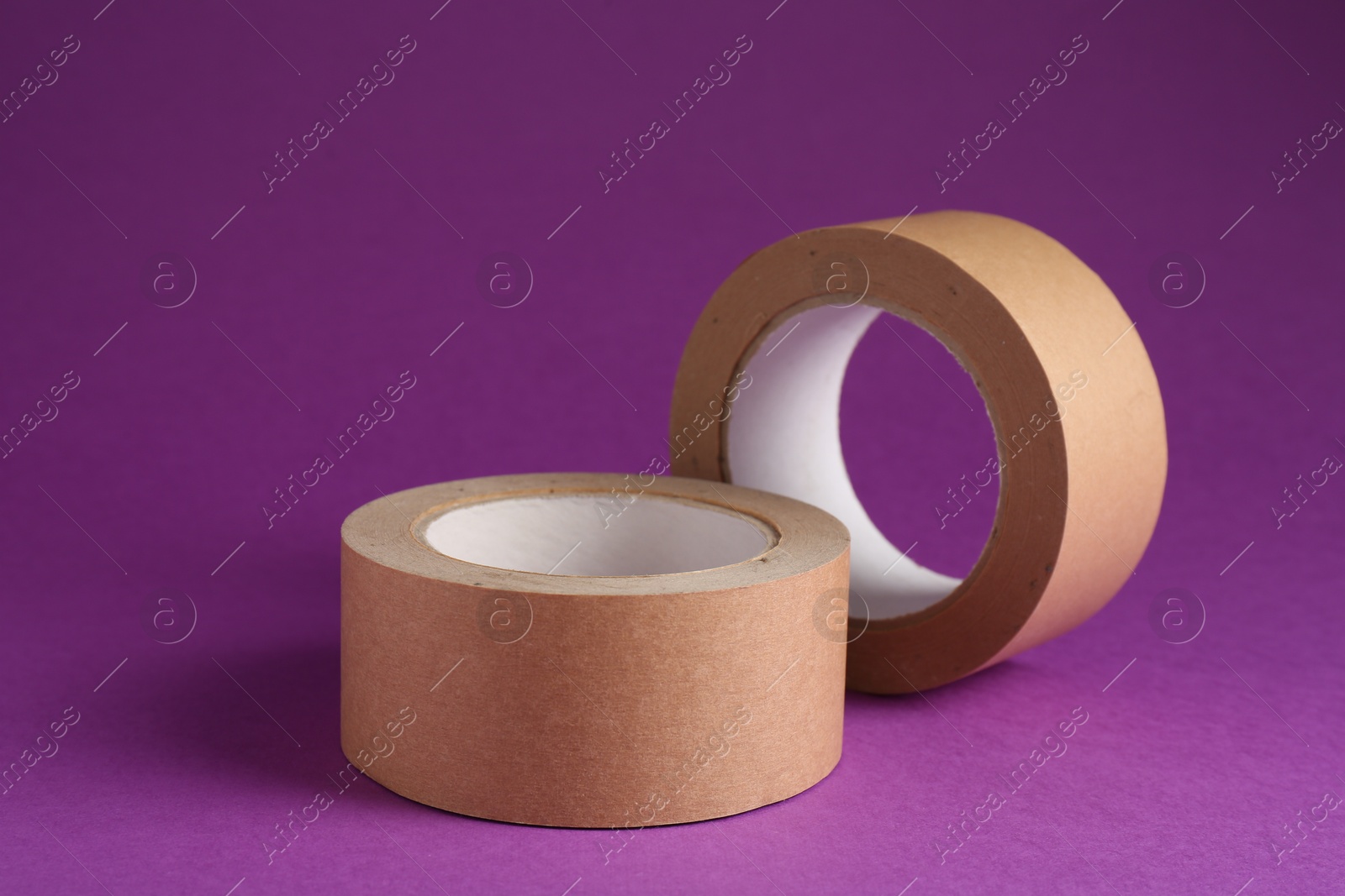 Photo of Rolls of masking tapes on violet background