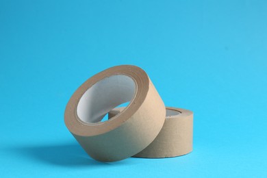 Photo of Rolls of masking tapes on light blue background