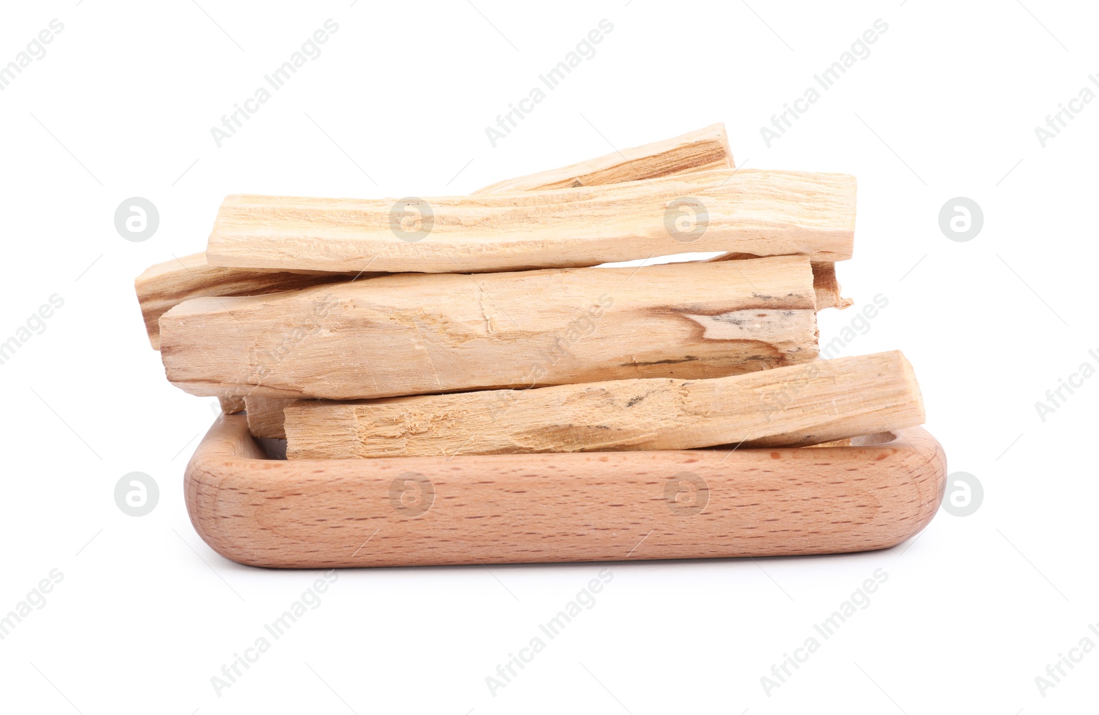 Photo of Pile of palo santo sticks on white background