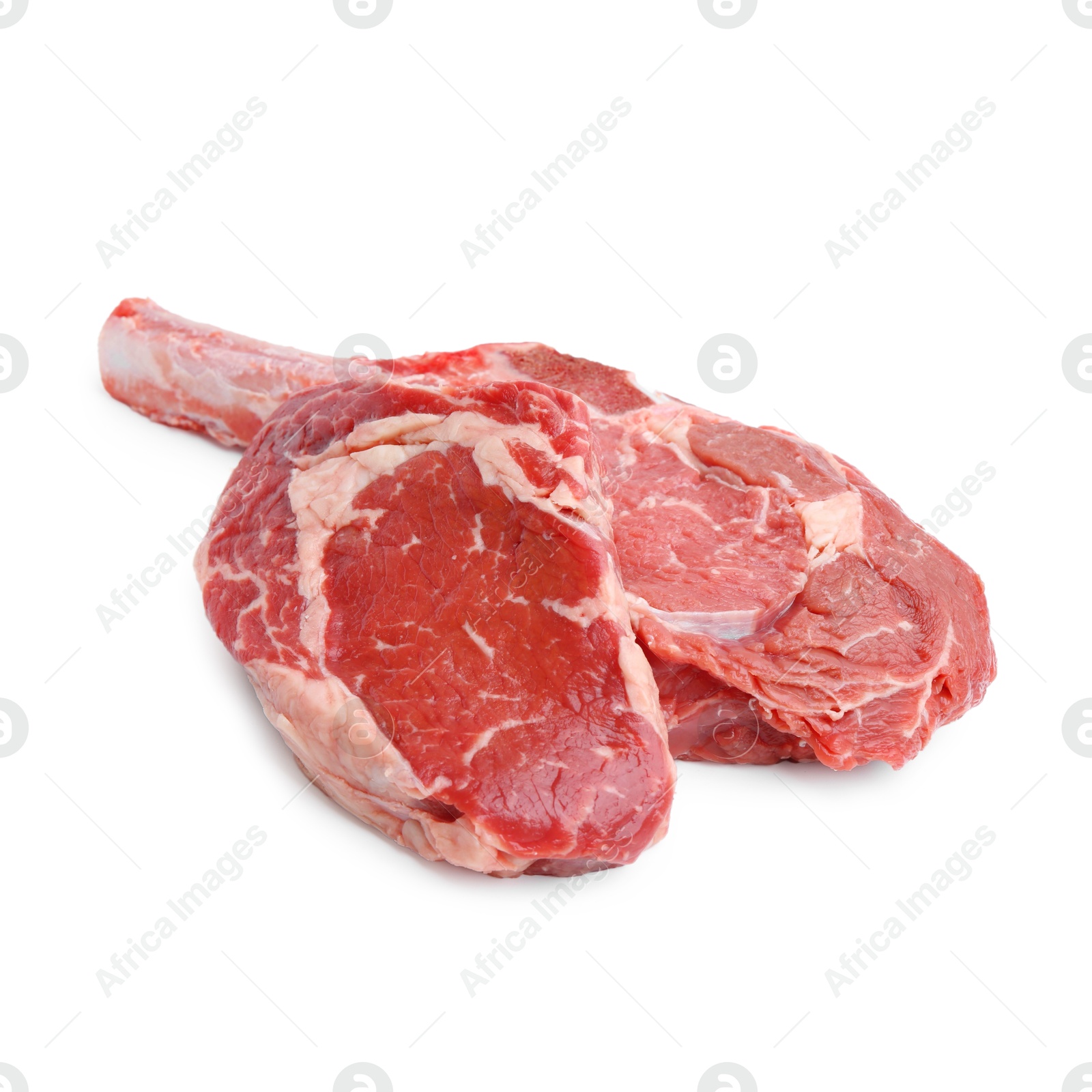 Photo of Pieces of raw beef meat isolated on white