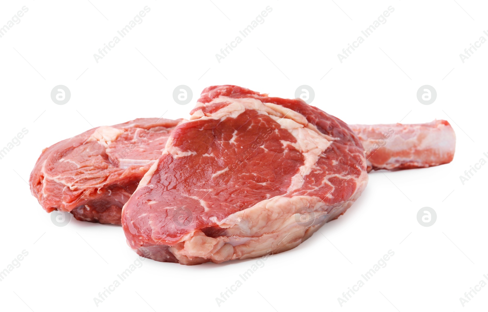 Photo of Pieces of raw beef meat isolated on white