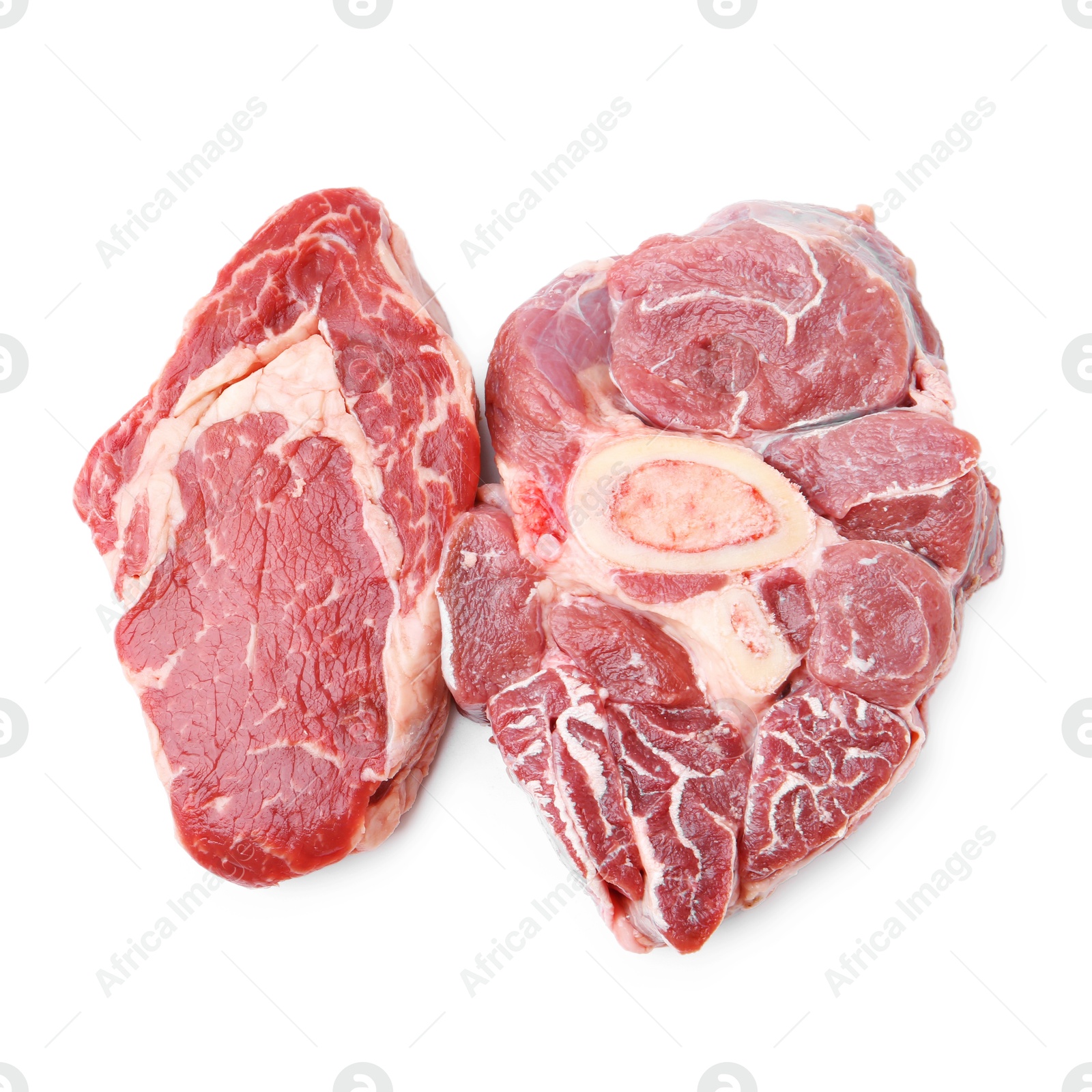 Photo of Pieces of raw beef meat isolated on white, top view