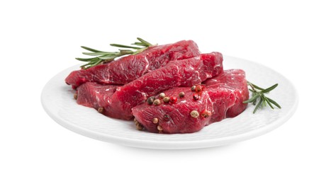 Photo of Pieces of raw beef meat and spices isolated on white