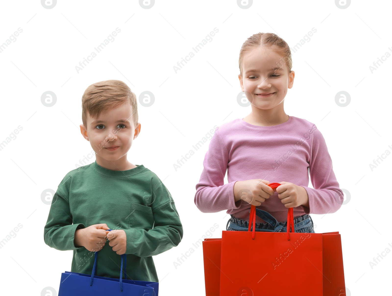 Photo of Cute little friends with shopping bags on white background