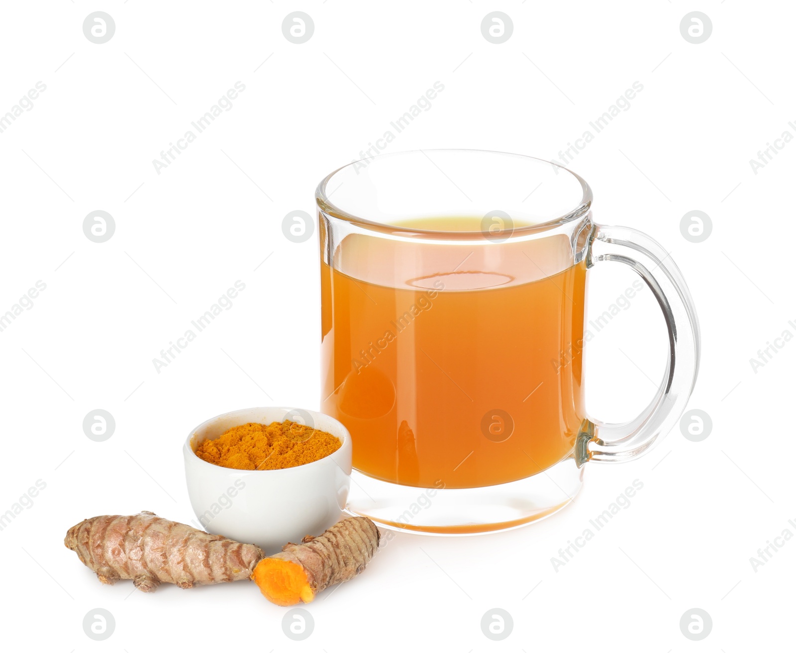 Photo of Aromatic turmeric tea in glass cup, roots and powder isolated on white