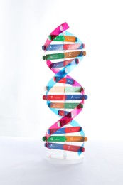 Photo of Colorful DNA structure model on white background