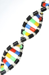 Photo of Colorful DNA structure model on white background