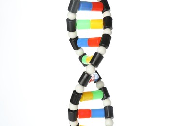 Photo of Colorful DNA structure model on white background