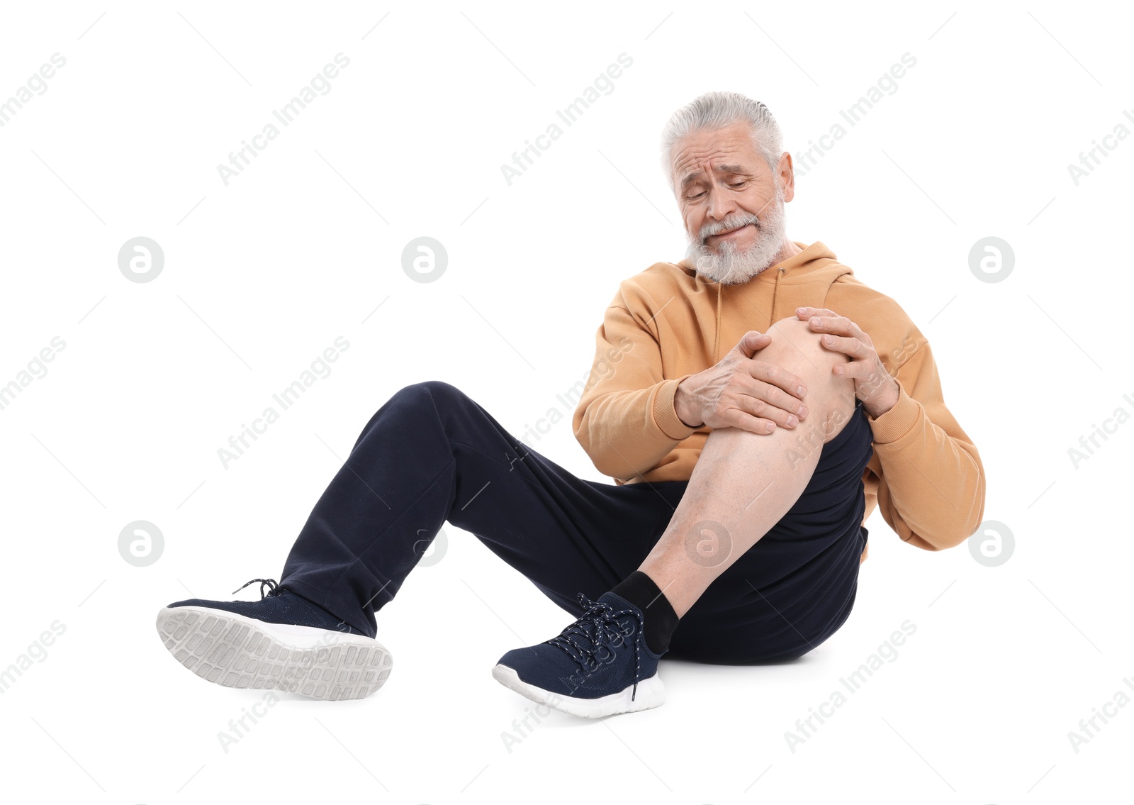 Photo of Senior man suffering from knee pain on white background