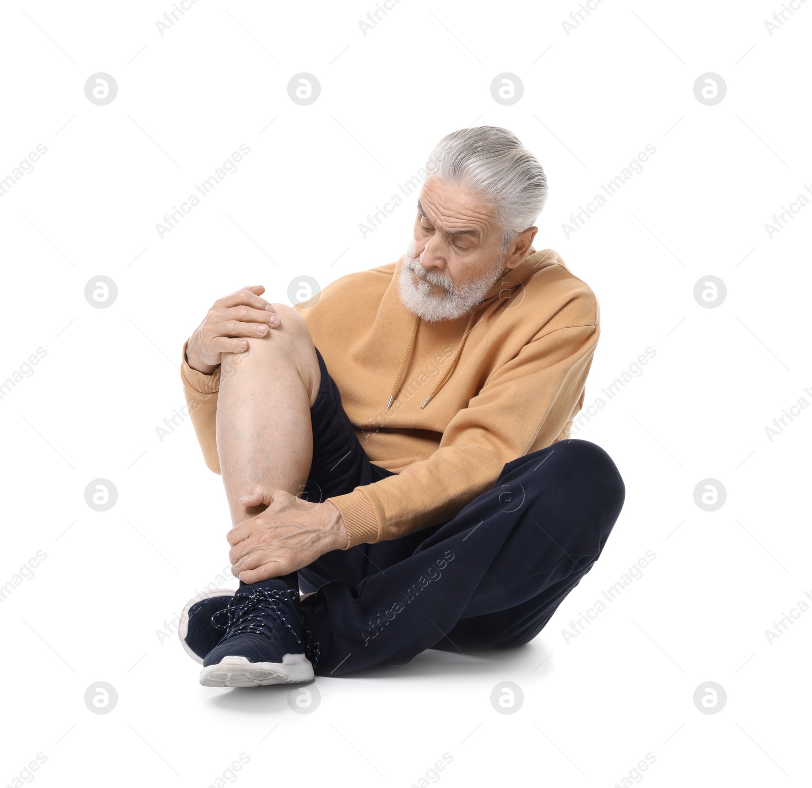 Photo of Senior man suffering from knee pain on white background