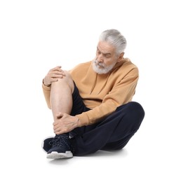 Photo of Senior man suffering from knee pain on white background