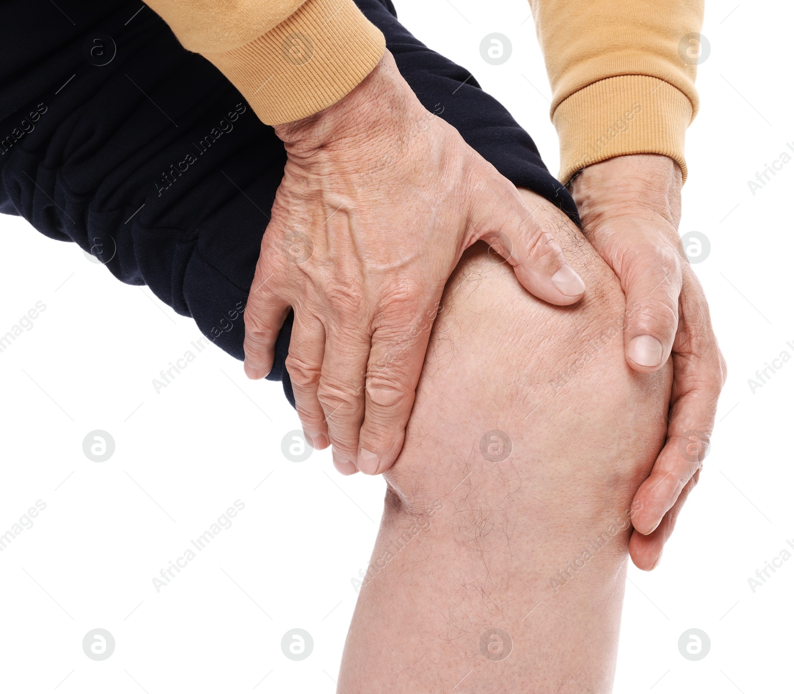 Photo of Senior man suffering from knee pain on white background, closeup