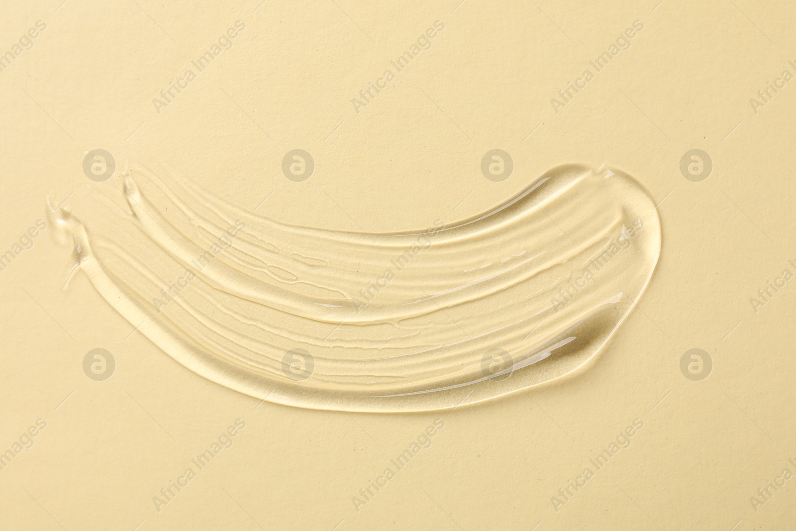 Photo of Sample of cosmetic product on beige background, top view