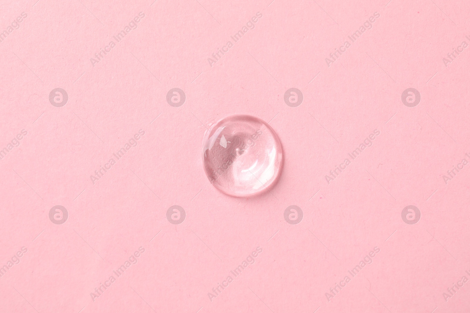 Photo of Sample of cosmetic product on pink background, top view