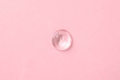 Photo of Sample of cosmetic product on pink background, top view