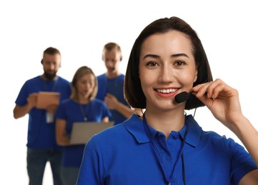 Photo of Technical support call center. Team of friendly operators on white background