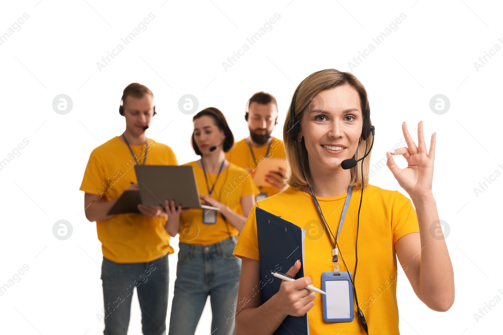 Photo of Technical support call center. Team of friendly operators on white background