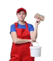 Professional painter with brush and bucket of paint on white background