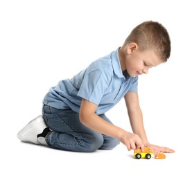 Photo of Little boy playing with toy car on white background