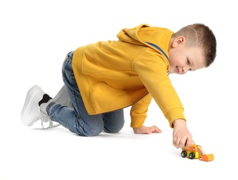 Photo of Little boy playing with toy car on white background