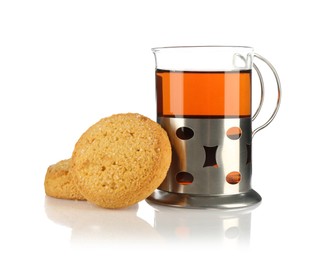 Photo of Glass of aromatic tea in holder and cookies isolated on white