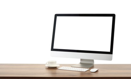 Photo of Computer monitor, keyboard, mouse and cup of drink on wooden desk against white background