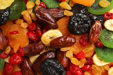 Photo of Mix of different dried fruits as background, closeup