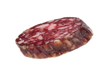 Piece of delicious dry cured sausage isolated on white