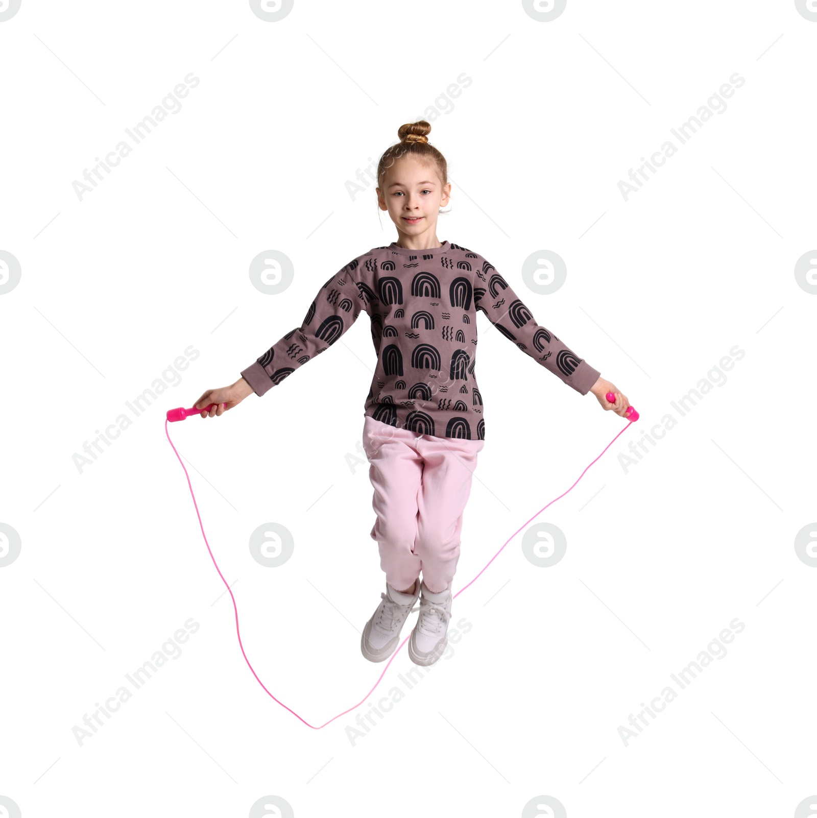 Photo of Cute little girl with jump rope on white background