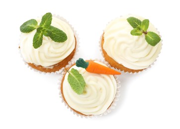 Photo of Delicious carrot cupcakes with mint isolated on white, top view