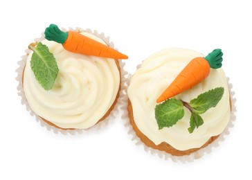 Photo of Delicious carrot cupcakes with mint isolated on white, top view