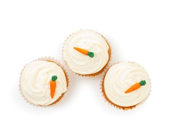 Photo of Delicious carrot cupcakes isolated on white, top view