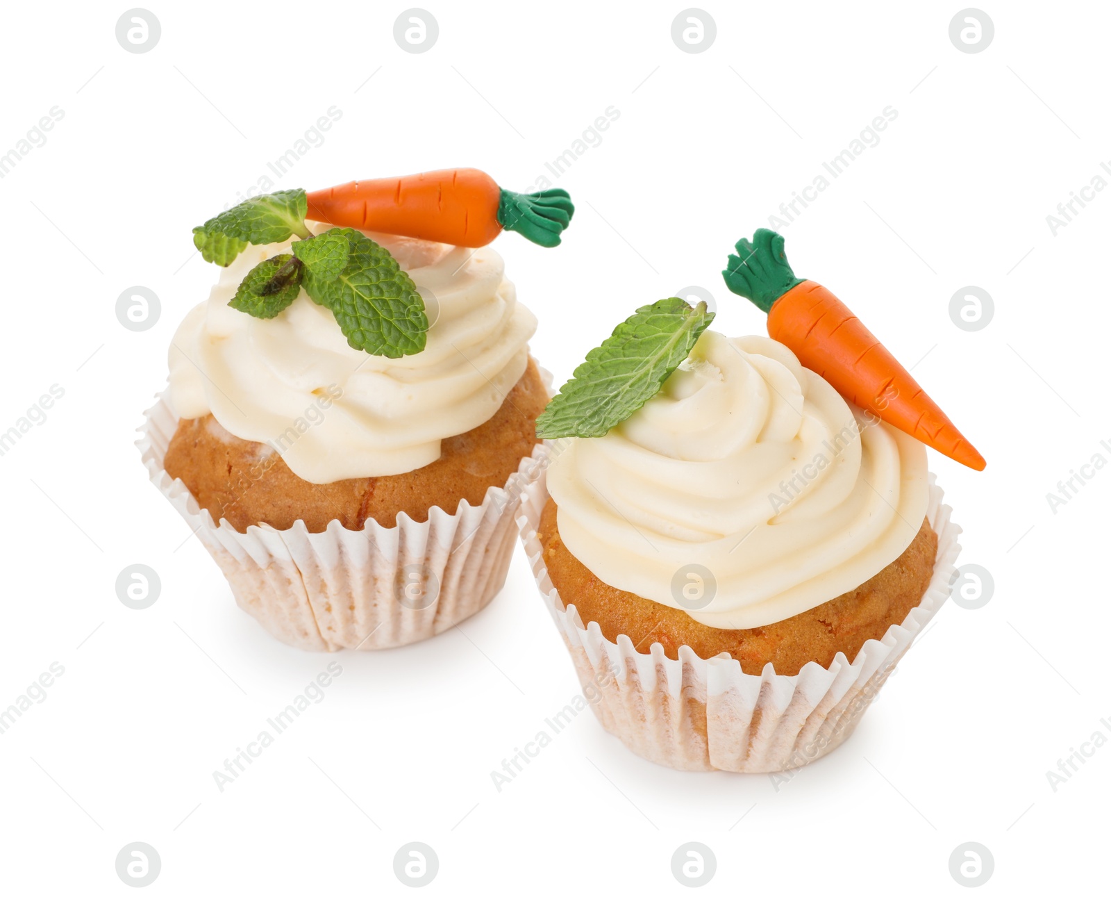 Photo of Delicious carrot cupcakes with mint isolated on white