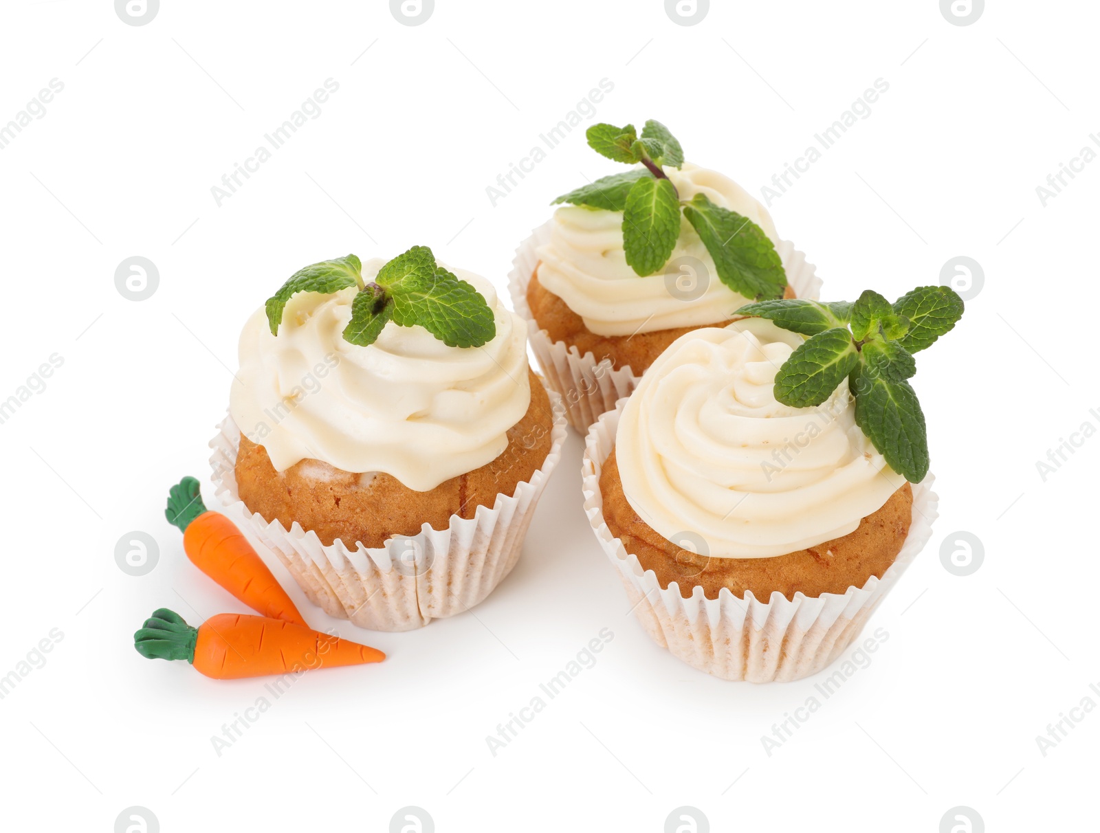 Photo of Delicious carrot cupcakes with mint isolated on white