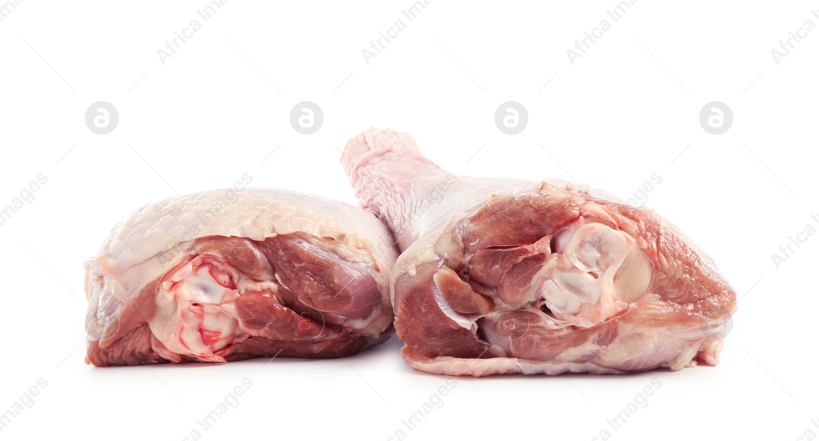 Photo of Two raw turkey drumsticks isolated on white