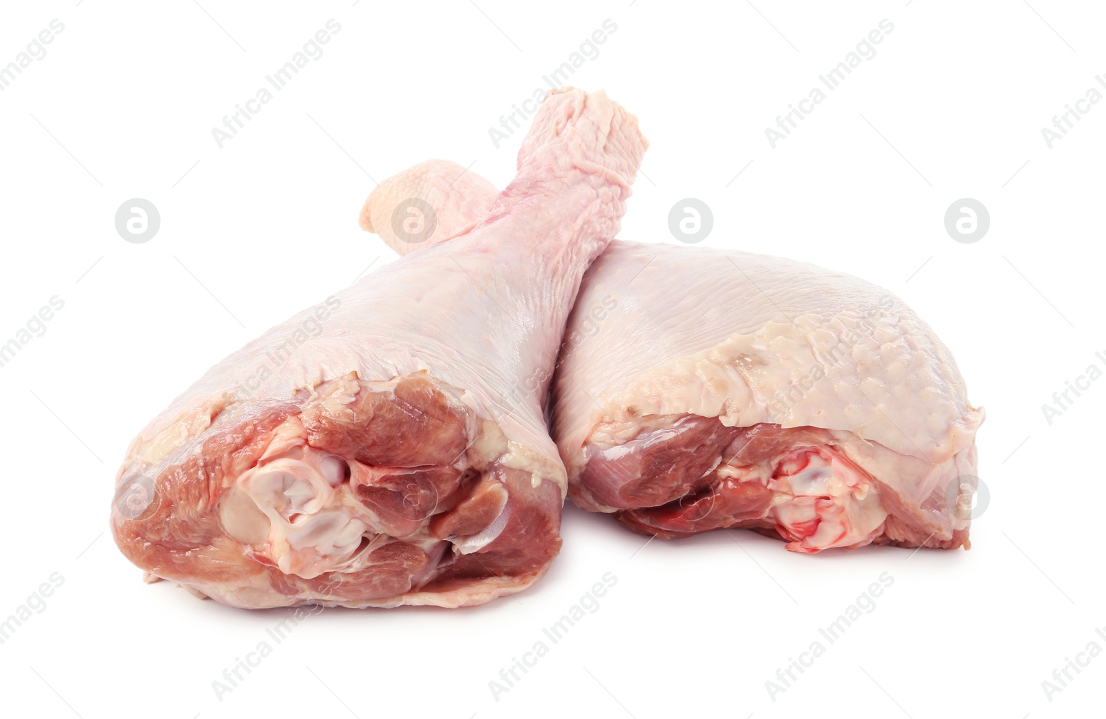 Photo of Two raw turkey drumsticks isolated on white