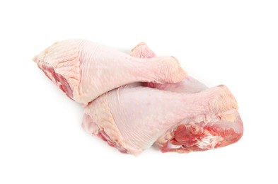 Photo of Three raw turkey drumsticks isolated on white, top view