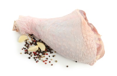 Photo of Raw turkey drumstick and spices isolated on white, top view